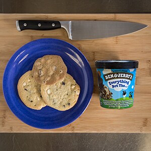 A Plate of cookies, pint of ice cream, and a knife