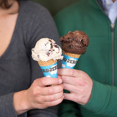 Two ice cream soul mates with cones of Ben & Jerry's ice cream