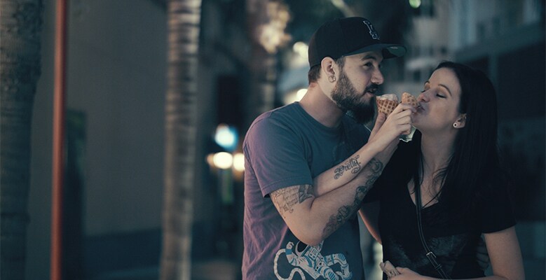Man and woman eating cones