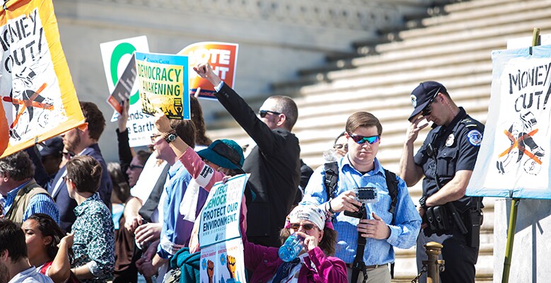 Protesters with signs at Capital Hill