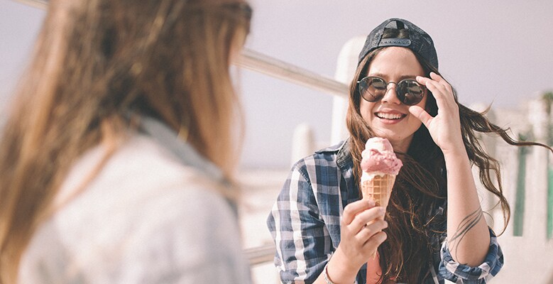 Teenagers eating ice cream cones