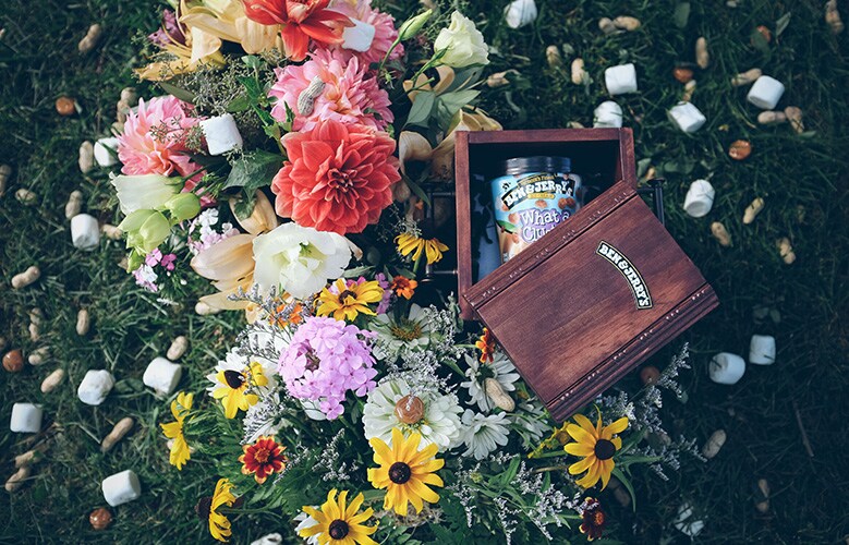 A box with Ben & Jerry's ice cream and flowers