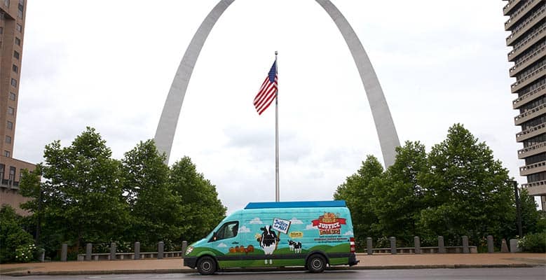 Ben & Jerry's scoop truck in front of the St. Louis arch